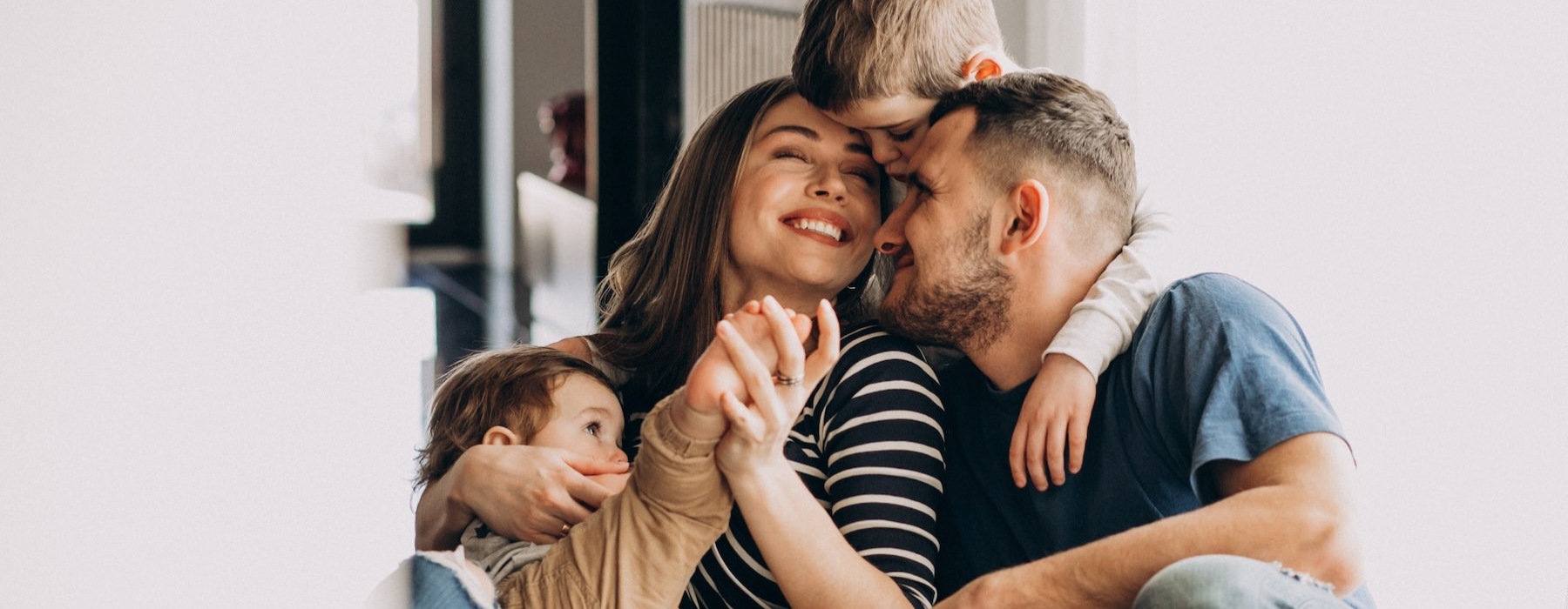 a family sitting on a couch