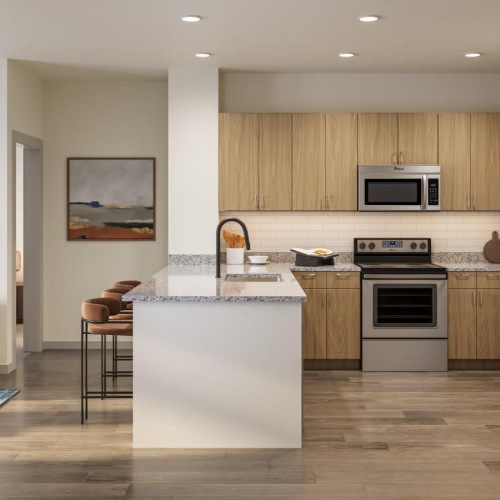 a kitchen with a couch and a table