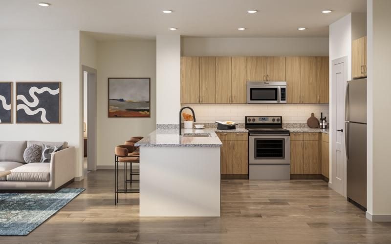 a kitchen with a couch and a table