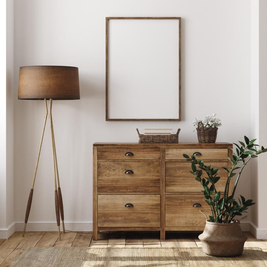 a wooden dresser with a lamp