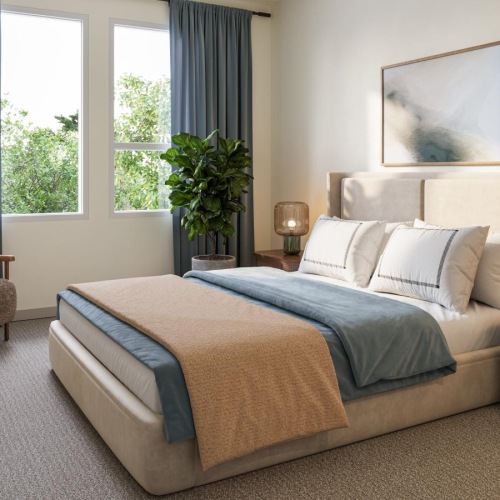 a bedroom with a bed and two nightstands